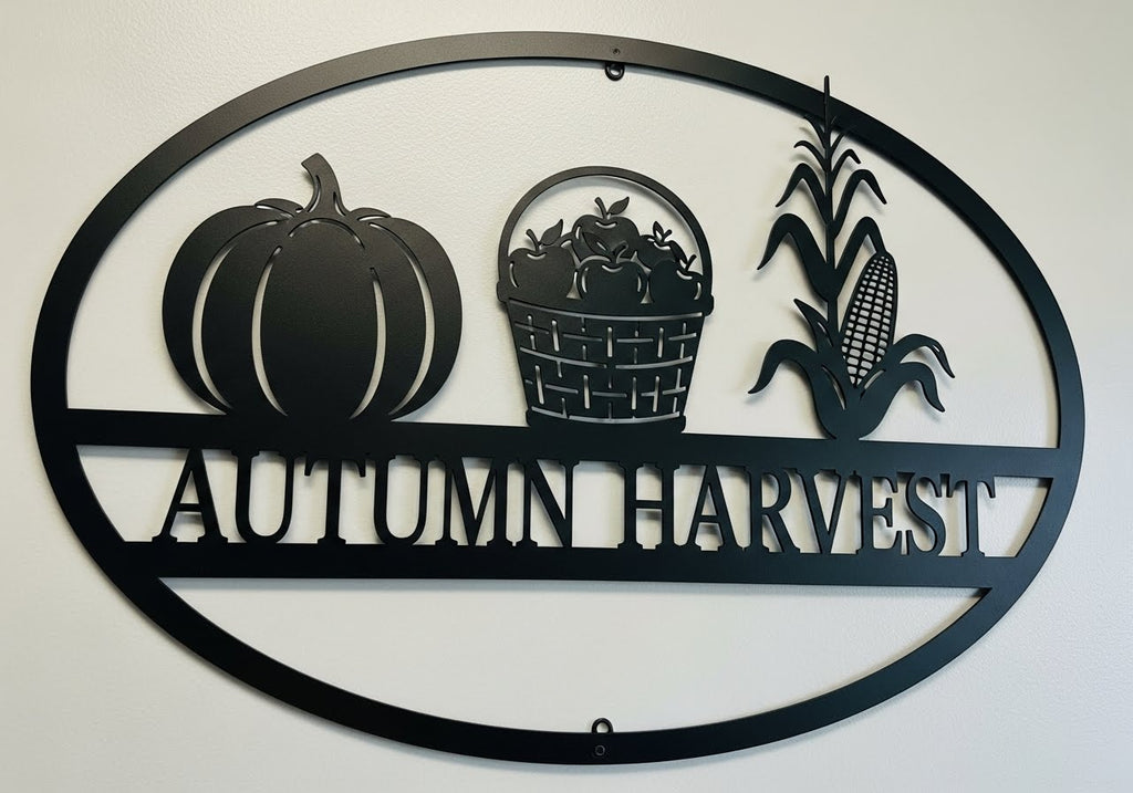Oval Autumn Harvest metal sign with pumpkins and fall leaves in black steel