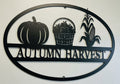 Oval Autumn Harvest metal sign with pumpkins and fall leaves in black steel