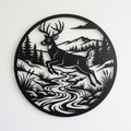 Round metal sign with deer leaping over a river, mountains and forest in black steel