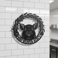 Personalized pig head farm sign with leaf wreath and name in black steel