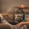 Round puppy welcome sign with paw prints in black steel