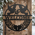 Round welcome sign with two doves and olive branch in black steel