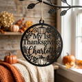 Personalized round My 1st Thanksgiving metal ornament with baby name and fall motifs