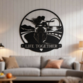 Round Life Together metal sign with couple riding a motorcycle in black steel