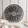 Personalized round floral mandala name sign in black steel